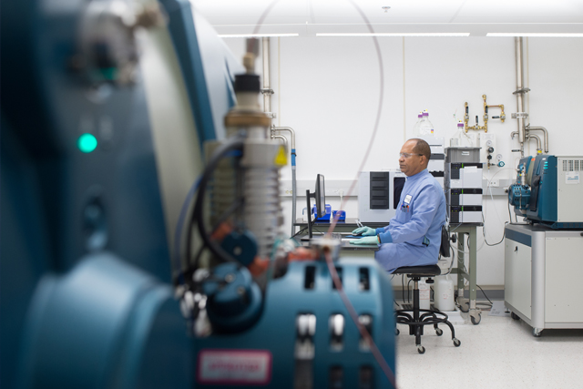 ADME scientist analyzing samples using mass spectrometer to determine drug concentrations