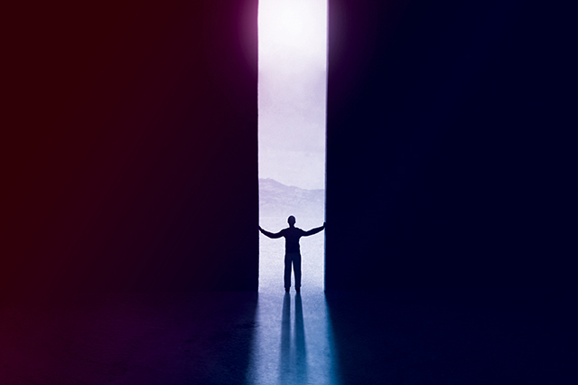 shadow of a person in a doorway over vital science colors.