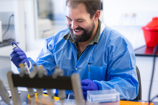 male scientist with a smile