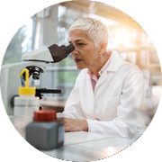 Scientist looking through a microscope