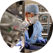 Pharmacokinetics is a key component of DMPK ADME studies. A male technician in safety gear reviews dosing and sampling of studies to determine the pharmacokinetic profile of promising compounds. Standard data generated includes time to Cmax, tmax, t1/2 elimination, and AUC.