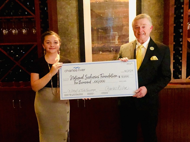 Niva presenting Joe O’Brien with Charles River’s donation, October 2019