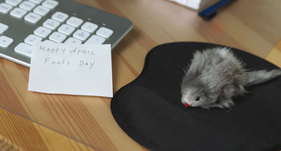 April Fools' Day, shown is computer with a stuffed mouse on mousepad