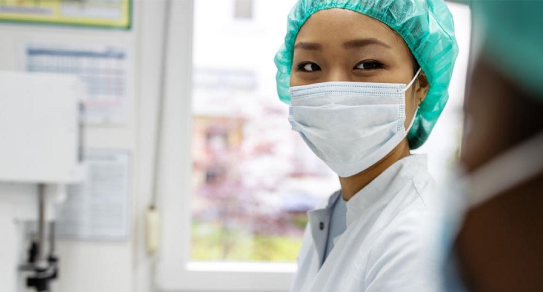 Asian scientist wearing a mask in a laboratory