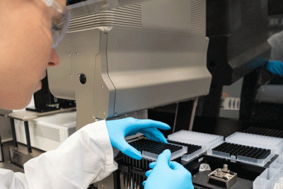 Scientist working in a next gene lab using automation