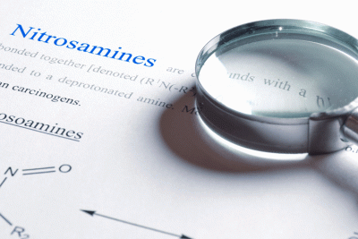 A magnifying glass over nitrosamine chemical structure